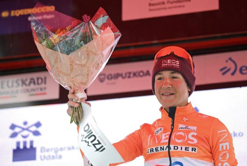 Stage winner team Ineos' US rider AJ August celebrates on the podium after the sixth and last stage of the Basque Country's Itzulia cycling tour, a 135.4 km race between Goizper-Antzuola and Bergara, on April 11, 2026.   ANDER GILLENEA / AFP