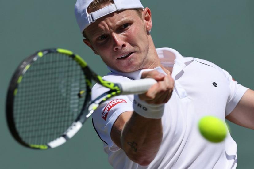 Netherlands' Jesper de Jong plays a forehand return to Serbia's Miomir Kecmanovic during their men's singles second round tennis match on the fourth day of the 2025 Wimbledon Championships at The All England Lawn Tennis and Croquet Club in Wimbledon, southwest London, on July 3, 2025.   Adrian Dennis / AFP