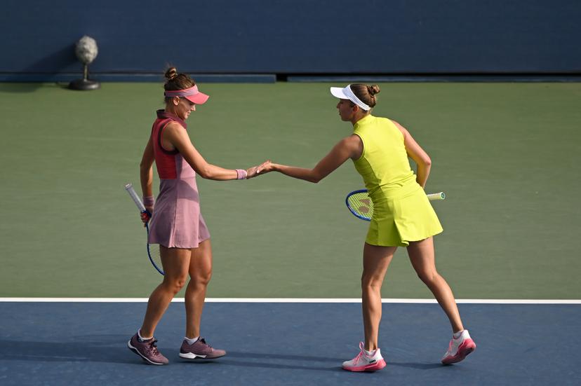 Belgian Elise Mertens (yellow) and Veronika Kudermetova (pink) pictured during a tennis match against Spanish-Argentinian pair Cavelle-Remers/Sierra, in the first round of the women's doubles of the 2025 US Open Grand Slam tennis tournament in New York City, USA, Thursday 28 August 2025. BELGA PHOTO TONY BEHAR