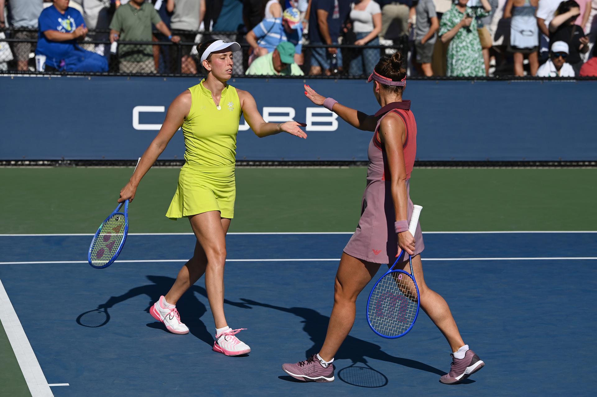 Belgian Elise Mertens (yellow) and Veronika Kudermetova (pink) pictured during a tennis match against US pair Brantmeier-Hamilton, in the second round of the women's doubles of the 2025 US Open Grand Slam tennis tournament in New York City, USA, Saturday 30 August 2025. BELGA PHOTO TONY BEHAR