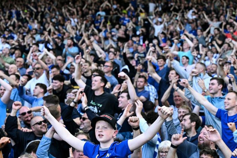 Everton supporters celebrate at the end of the English Premier League football match between Fulham and Everton at Craven Cottage in London on May 10, 2025. Everton wins 3 - 1 against Fulham. Ben STANSALL / AFP