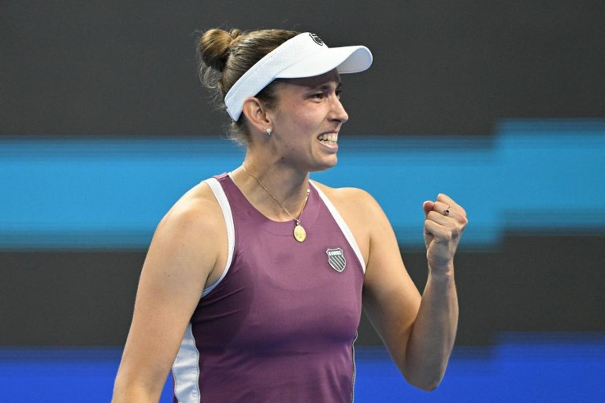 Belgium's Elise Mertens reacts after beating Poland's Iga Swiatek in their women's singles quarter-final at the China Open tennis tournament in Beijing on October 9, 2026.  GREG BAKER / AFP