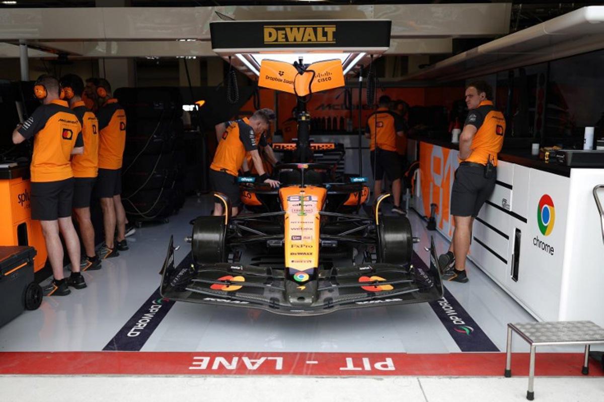 McLaren technicians work on the car of McLaren's Australian driver Oscar Piastri during a practice session for the 2025 Miami Formula One Grand Prix at Miami International Autodrome in Miami Gardens, Florida, on May 2, 2025.   CHARLY TRIBALLEAU / AFP