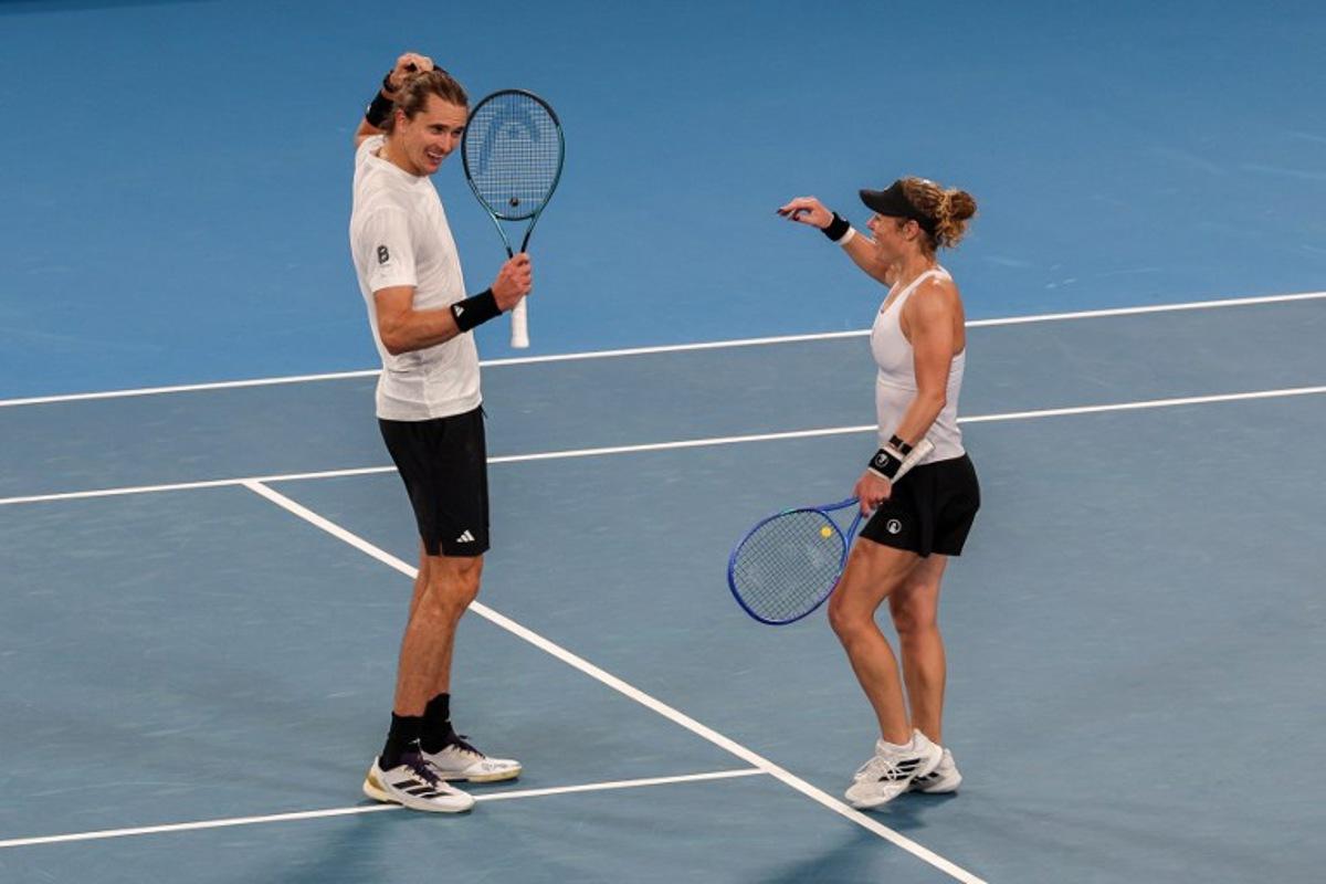 Germany's Alexander Zverev and Laura Siegemund celebrate after victory against Netherlands' Tallon Griekspoor and Demi Schuurs during their doubles match at the United Cup tennis tournament in Sydney on January 4, 2026.  Izhar KHAN / AFP