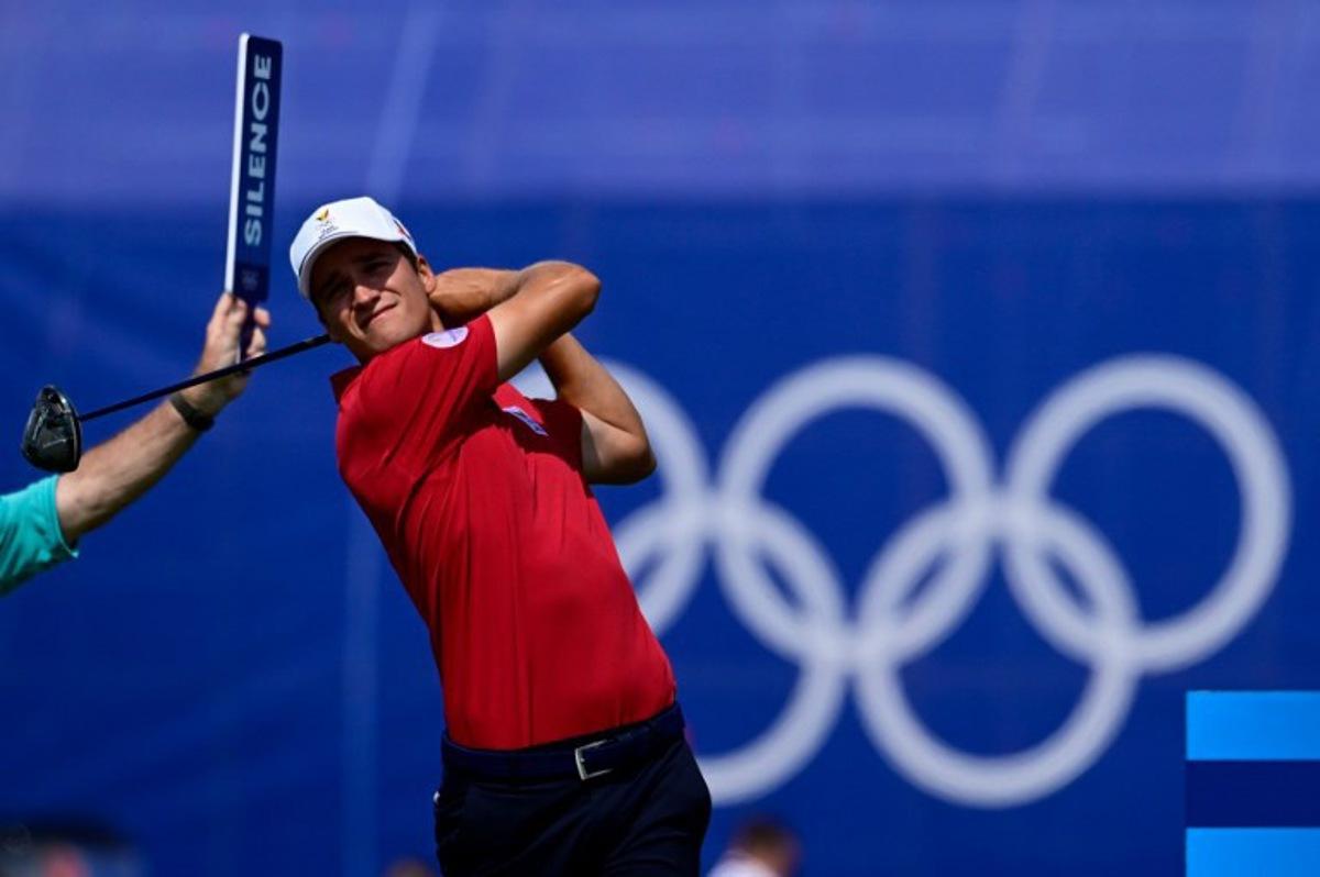Belgium's Adrien Dumont de Chassart tees off in round 2 of the men's golf individual stroke play of the Paris 2024 Olympic Games at Le Golf National in Guyancourt, south-west of Paris on August 2, 2024.   John MACDOUGALL / AFP