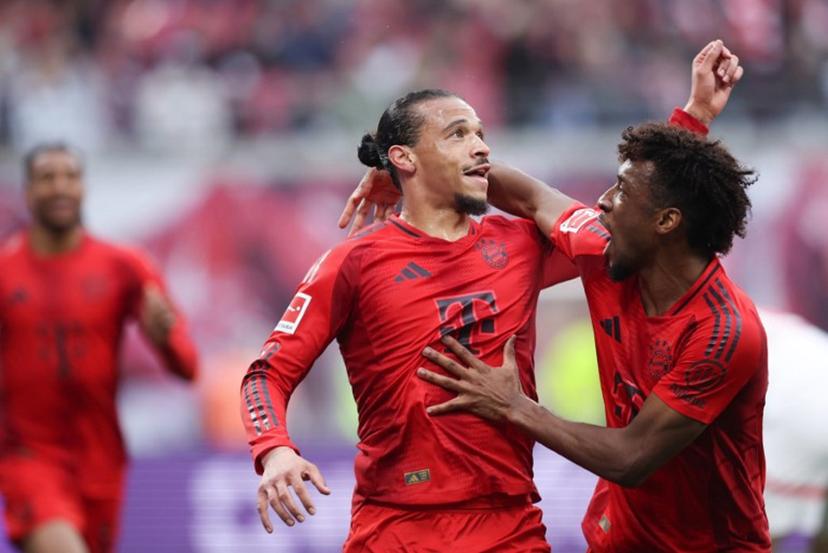 Bayern Munich's German forward #10 Leroy Sane (C) celebrates scoring the 2-3 during the German first division Bundesliga football match between RB Leipzig and FC Bayern Munich in Leipzig, eastern Germany on May 3, 2025.  RONNY HARTMANN / AFP