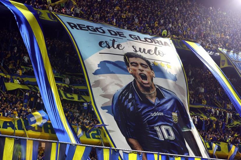 Boca Juniors' fans display a giant flag depicting Argentine football legend Diego Maradona during the Argentine Professional League 2026 Clausura tournament football match between Boca Juniors and Union de Santa Fe at La Bombonera stadium in Buenos Aires on October 2, 2026.  Alejandro PAGNI / AFP
