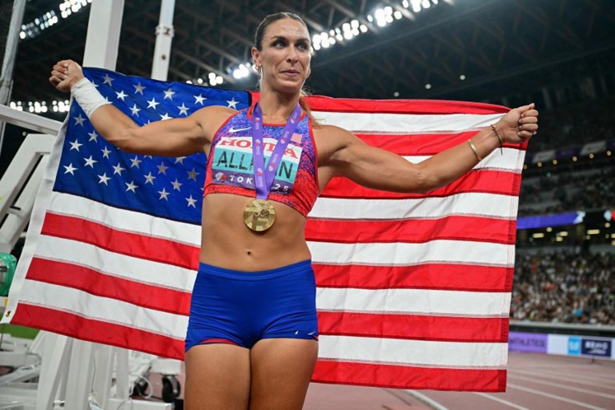 US' athlete Valarie Allman celebrates with her medal after winning the women's discus throw final during the World Athletics Championships in Tokyo on September 14, 2025.  Ben STANSALL / AFP