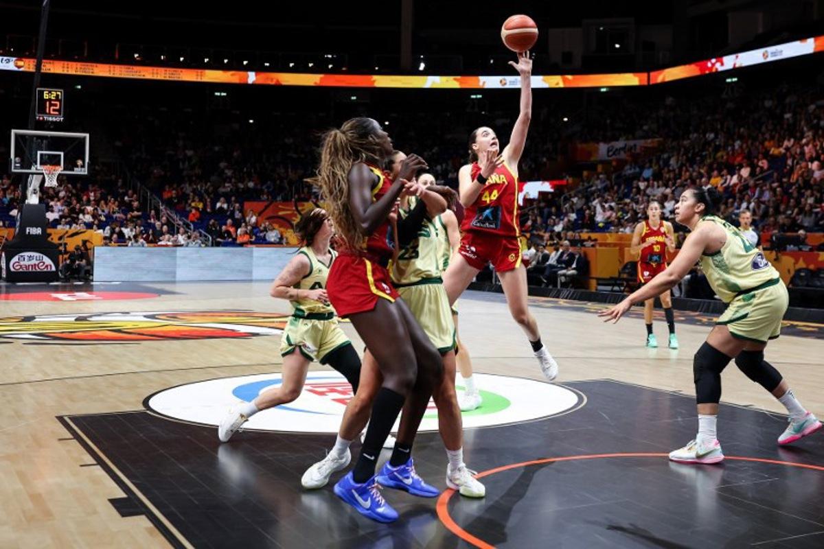 Australia's center #22 Zitina Aokuso (R) and Spain's point guard #44 Iyana Martin (C) vie for the ball during the 2026 FIBA Women's Basketball World Cup quarter-final match between Australia and Spain at the Berlin Arena in Berlin on September 10, 2026.  Ronny HARTMANN / AFP
