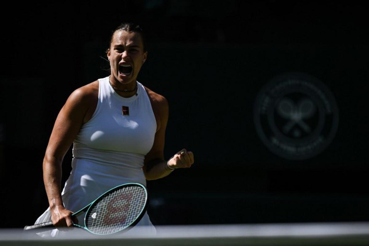 Belarus's Aryna Sabalenka reacts as she plays against Germany's Laura Siegemund during their women's singles quarter-final tennis match on the ninth day of the 2025 Wimbledon Championships at The All England Lawn Tennis and Croquet Club in Wimbledon, southwest London, on July 8, 2025.  Kirill KUDRYAVTSEV / AFP