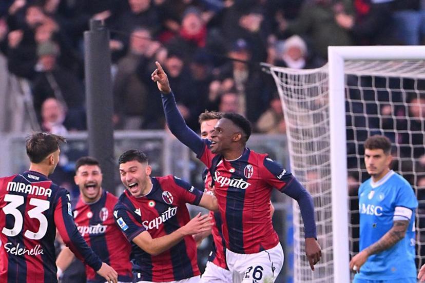 Bologna's Colombian defender #26 Jhon Lucumi (C) celebrates with teammates after scoring during the Italian Serie A football match between Bologna and Napoli at the Renato Dall'Ara stadium in Bologna on April 7, 2025.  Andreas SOLARO / AFP
