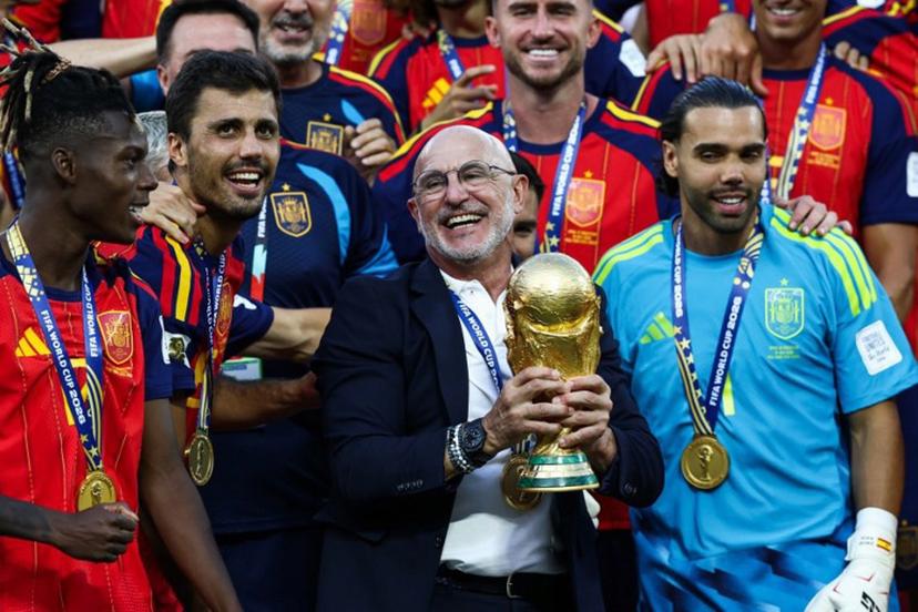 Spain's head coach Luis de la Fuente holds the trophy after winning the 2026 World Cup football tournament final match between Spain and Argentina at the New York/New Jersey Stadium in East Rutherford on July 19, 2026.   FRANCK FIFE / AFP