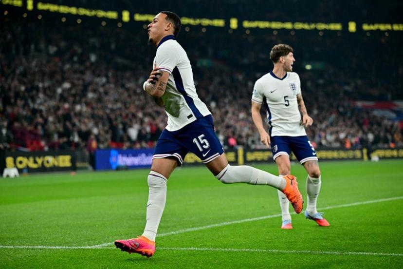 England striker Morgan Rogers celebrates scoring the team's first goal during the friendly football match between England and Wales at Wembley Stadium in London on October 9, 2025.   Ben STANSALL / AFP