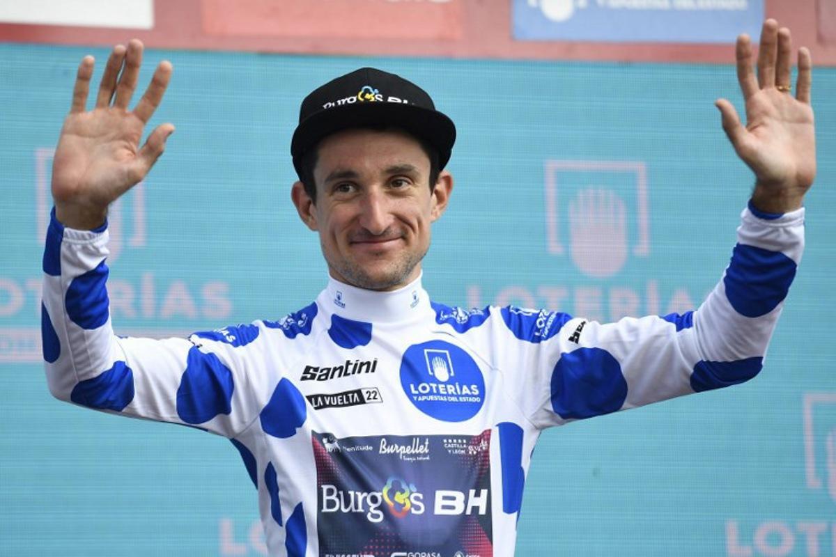 Team Burgos - BH's Monegasque rider Victor Langelotti celebrates on the podium wearing the best climber's dotted jersey after the 7th stage of the 2022 La Vuelta cycling tour of Spain, a 190 km race from Camargo to Cistierna, on August 26, 2022.  ANDER GILLENEA / AFP