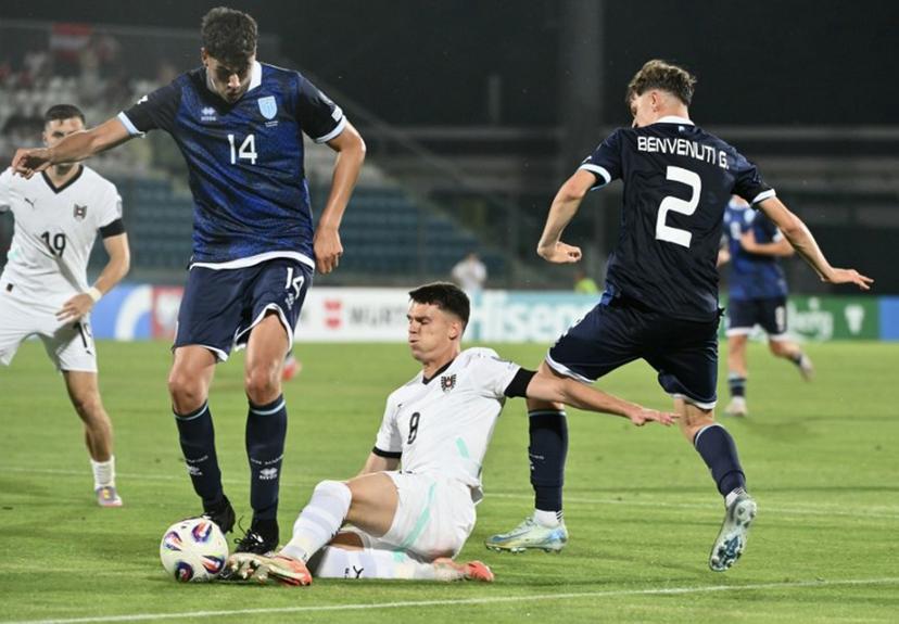 Austria's midfielder #06 Nicolas Seiwald (C) fights of the ball with San Marino's midfielder #14 Giacomo Valentini (L) and San Marino's defender #02 Giacomo Benvenuti during the FIFA World Cup 2026 Group H European qualification football match between San Marino and Austria at the Olympic Stadium in Serravalle, San Marino, on June 10, 2025.  Alberto PIZZOLI / AFP