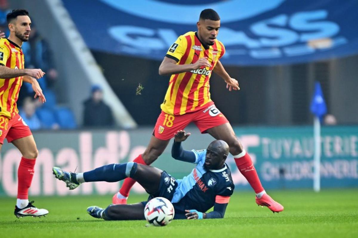 Le Havre's Guinean midfielder #94 Abdoulaye Toure fights for the ball with Lens' French midfielder #18 Andy Diouf during the French L1 football match between Le Havre AC and RC Lens at The Stade Oceane in Le Havre, north-western France, on January 12, 2025.  Lou BENOIST / AFP