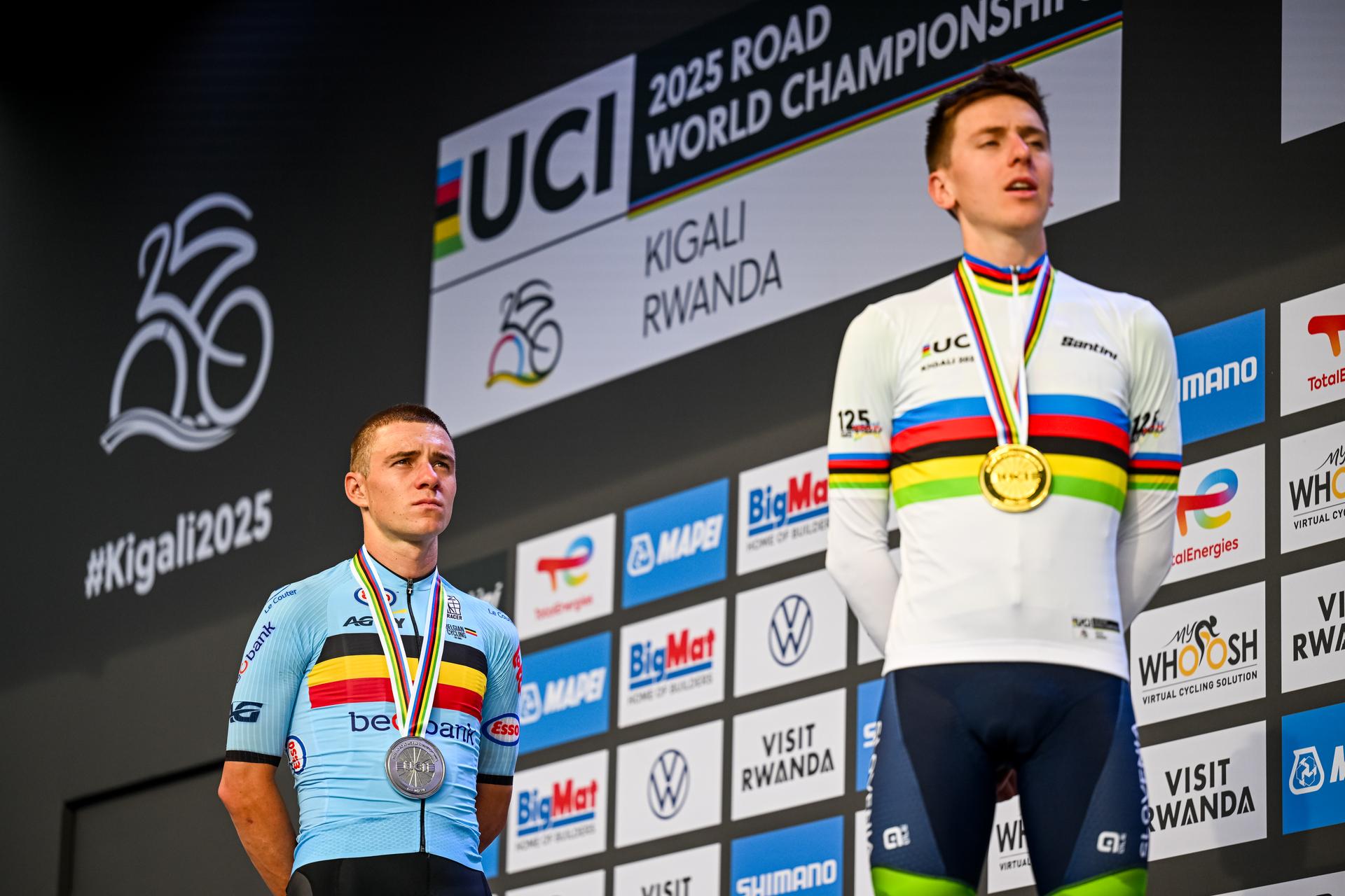 Belgian Remco Evenepoel and Slovenian Tadej Pogacar pictured on the podium after the elite men road race (267,5 km) at the cycling road World Championships in Kigali, Rwanda, Sunday 28 September 2025. The 2025 UCI Road World Championships take place from 21 to 28 September in Kigali, Rwanda. BELGA PHOTO DIRK WAEM