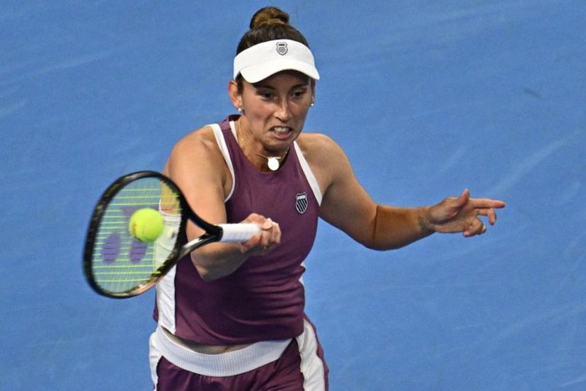 Belgium's Elise Mertens hits a return to Poland's Iga Swiatek during their women's singles quarter-final at the China Open tennis tournament in Beijing on October 9, 2026.  Pedro Pardo / AFP