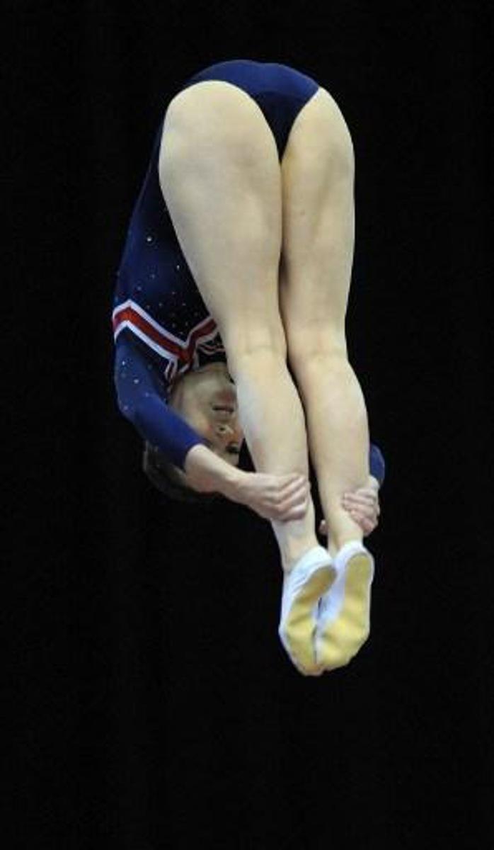 Katherine Driscoll of Britain performs during the women's Trampoline team final at the Trampoline and Tumbling World Championships at the National indoor Arena in Birmingham, central England on November 18, 2011.   AFP PHOTO/ ANDREW YATES