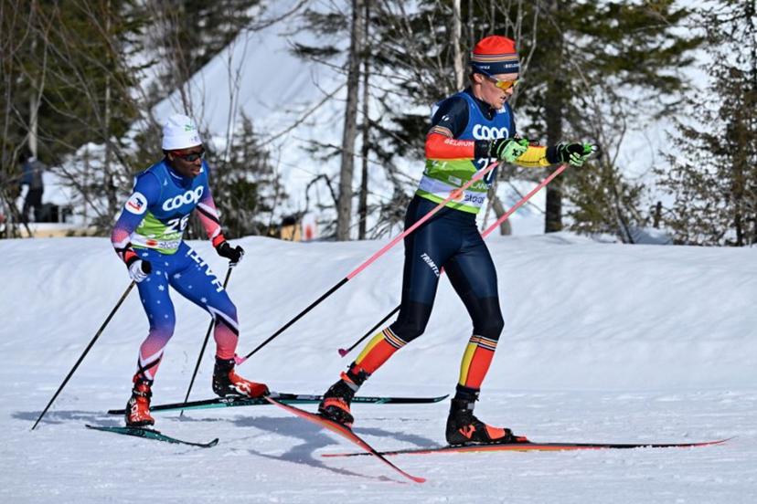 Belgium's Mathis Poutot (R) skis ahead of Haiti's Theo Mallett during the Men's Cross-Country 10km Free qualification of the FIS Nordic World Ski Championships in Planica on February 22, 2023.  Joe Klamar / AFP