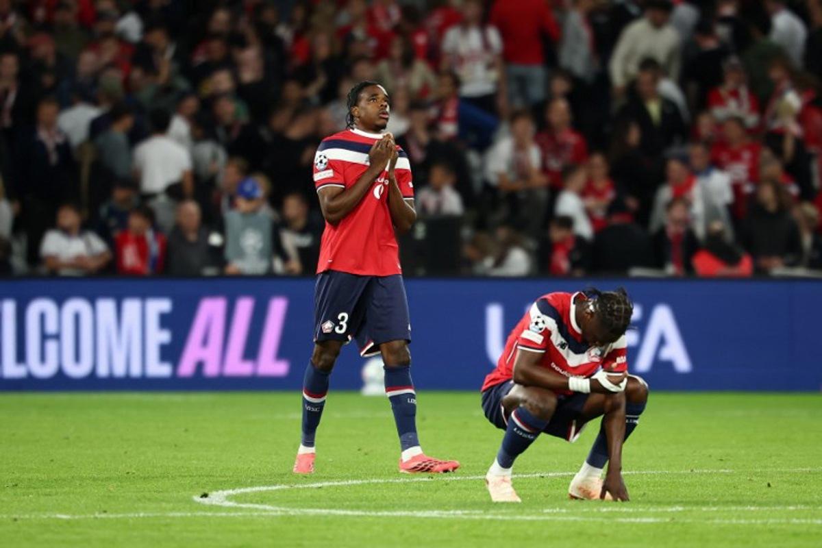 Lille's Brazilian defender #04 Alexsandro (R) and Lille's Belgian defender #03 Nathan Ngoy (L) react at the end of the UEFA Champions League, league phase day 1, football match between Lille (FRA) and Real Betis (ESP) at the Stade Pierre Mauroy, in Villeneuve d'Ascq, on September 8, 2026.  Sameer AL-DOUMY / AFP
