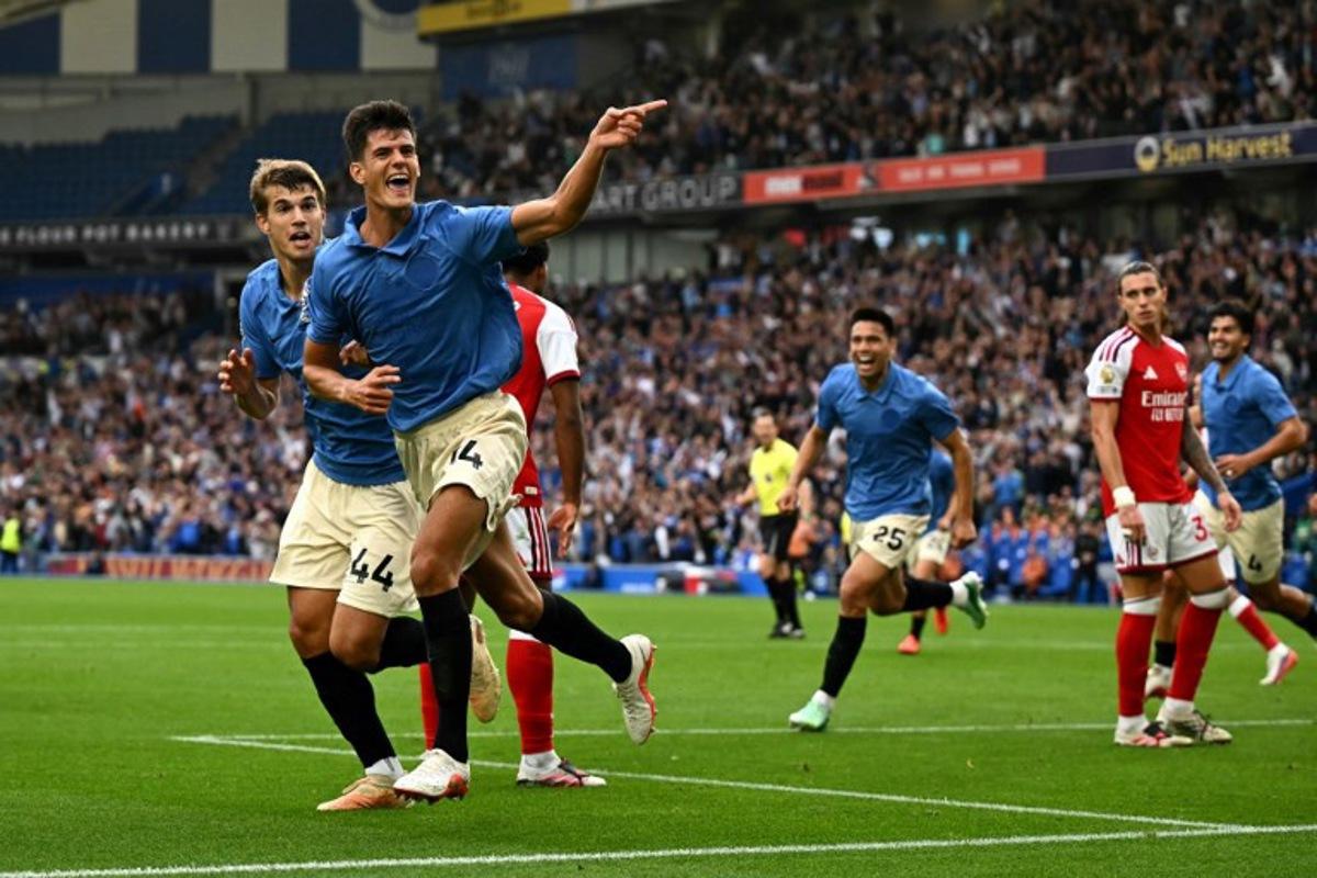 Brighton's Spanish midfielder #14 Chema Andrés celebrates scoring the team's third goal during the English Premier League football match between Brighton and Hove Albion and Arsenal at the American Express Community Stadium in Brighton, southern England on September 19, 2026.  Glyn KIRK / AFP
