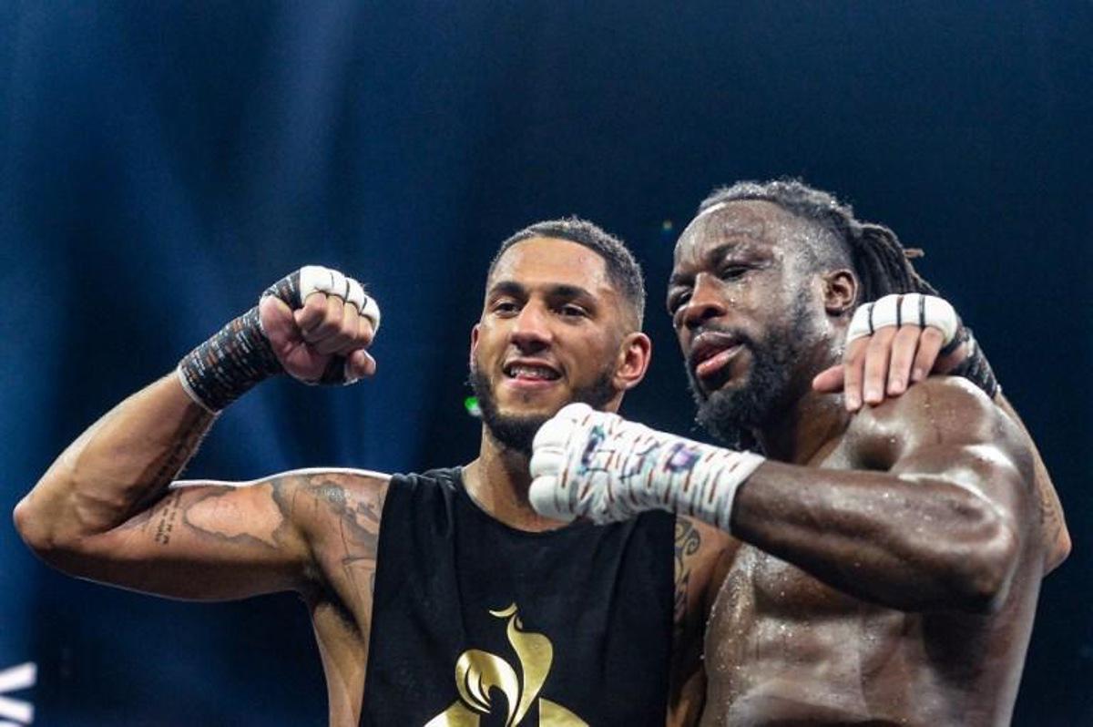 France's Tony Yoka (L) poses with Belgium's Joel Tambwe Djeko after winning their EBU European Union heavyweight title boxing match at the H Arena in Nantes, western France, on March 5, 2021.   JEAN-FRANCOIS MONIER / AFP