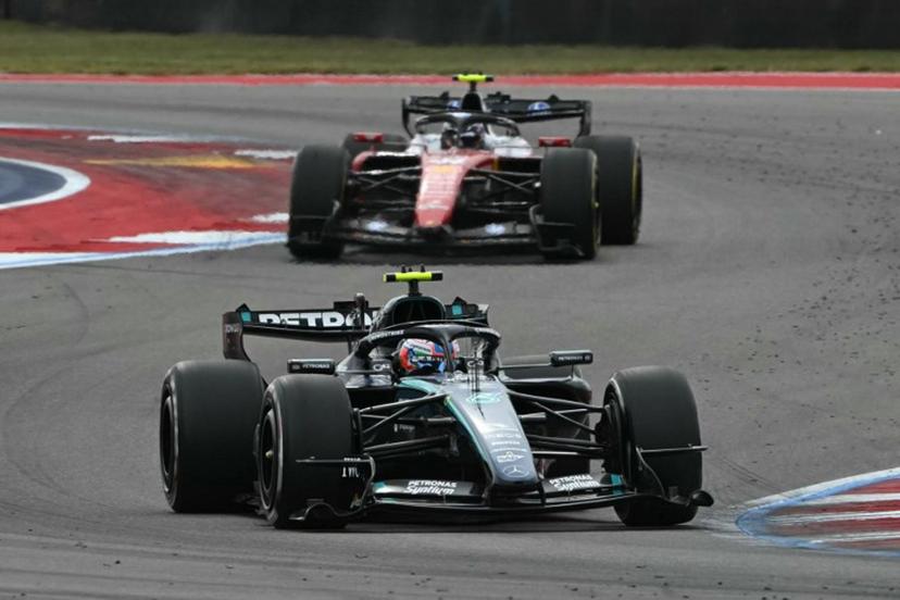 Mercedes' Italian driver Kimi Antonelli races ahead of Ferrari's British driver Lewis Hamilton during the United States Formula One Grand Prix at the Circuit of the Americas in Austin, Texas, on October 25, 2026.  RONALDO SCHEMIDT / AFP