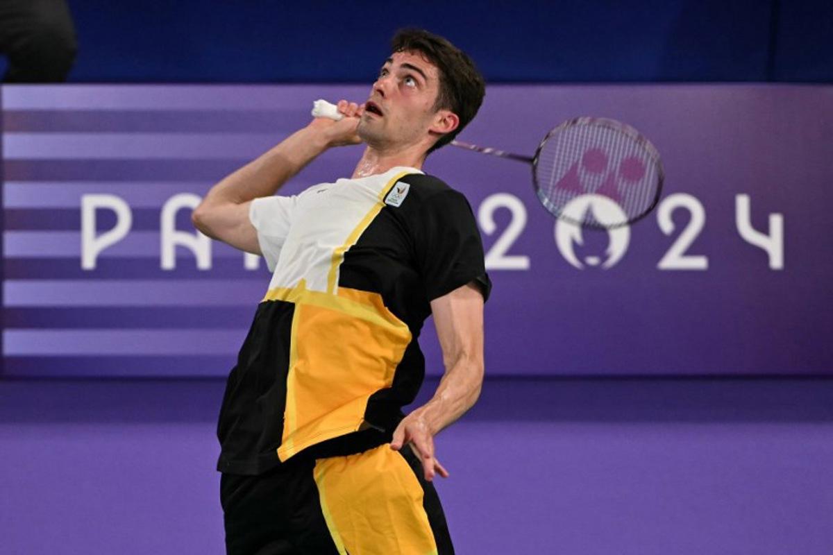 Belgium's Julien Carraggi plays a shot against India's Lakshya Sen in their men's singles badminton group stage match during the Paris 2024 Olympic Games at Porte de la Chapelle Arena in Paris on July 29, 2024.  Arun SANKAR / AFP