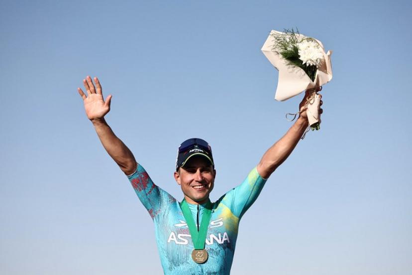 XDS Astana Team italian Matteo Malucelli celebrates on the podium after winning the fourth stage of the AlUla Tour cycling race, 173,4 km from Winter Park to Hegra on January 30, 2026.  Anne-Christine POUJOULAT / AFP