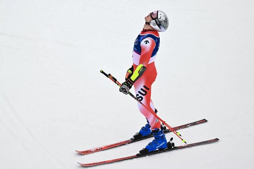 Switzerland's Marco Odermatt reacts after the second run of the men's giant slalom alpine skiing event during the Milano Cortina 2026 Winter Olympic Games at the Stelvio Ski Centre in Bormio (Valtellina) on February 14, 2026.  Fabrice COFFRINI / AFP