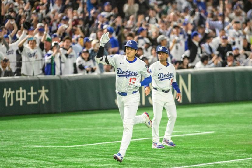 Los Angeles Dodgers's Shohei Ohtani celebrates after hitting a home-run during the baseball game between the Los Angeles Dodgers and Chicago Cubs in the MLB Tokyo Series at the Tokyo Dome in Tokyo on March 19, 2025.  Philip FONG / AFP