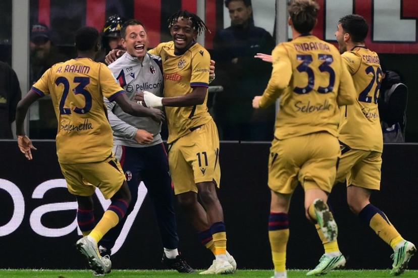 Bologna's Belgian forward #11 Samuel Mbangula celebrates with teammates after scoring a goal during the Italian Serie A football match between AC Milan and Bologna at the San Siro stadium in Milan, northern Italy on October 28, 2026.  Marco Bertorello / AFP