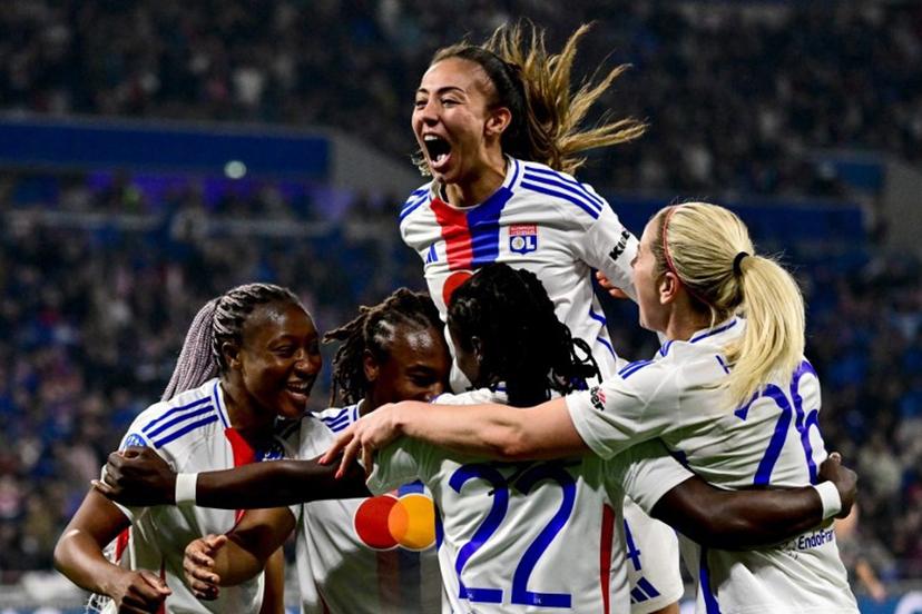 Lyon's French defender #04 Selma Bacha (C) celebrates her team scoring a goal with teammates during the UEFA Women's Champions League quarter final second leg football match between Olympique Lyonnais (FRA) and FC Bayern Munich (GER) at the OL Stadium in Decines-Charpieu, central-eastern France, on March 26, 2025.  OLIVIER CHASSIGNOLE / AFP