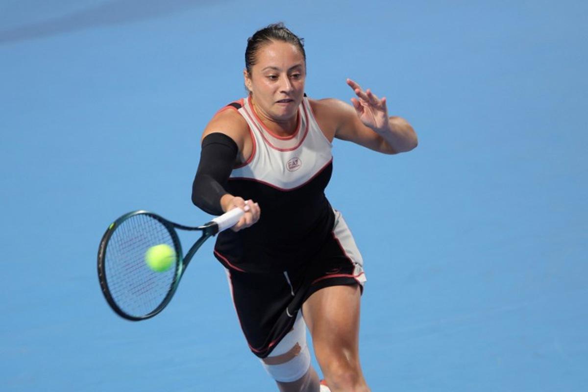 Italy's Elisabetta Cocciaretto hits a return to USA's Ann Li during their women's singles quarter-final match at the Guangzhou Open tennis tournament in Guangzhou, China's southern Guangdong province on October 24, 2025.  -STR / AFP