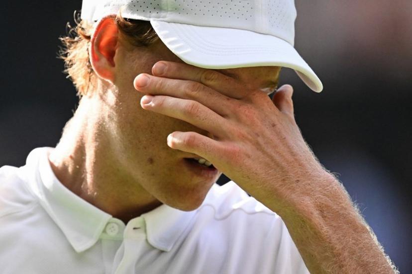 Italy's Jannik Sinner reacts as he plays against Spain's Carlos Alcaraz during their men's singles final tennis match on the fourteenth day of the 2025 Wimbledon Championships at The All England Lawn Tennis and Croquet Club in Wimbledon, southwest London, on July 13, 2025.  Kirill KUDRYAVTSEV / AFP