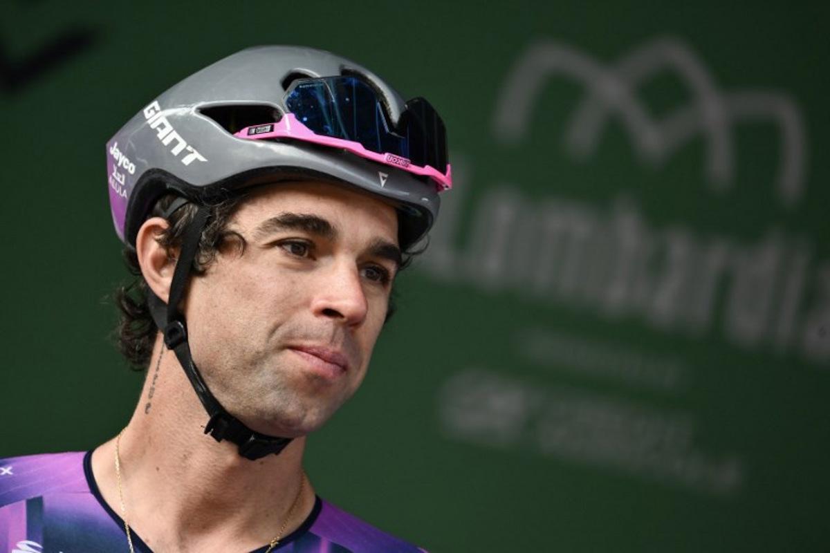 Team Jayco AlUla's Australian riderMichael Matthews looks on from the sign-in podium ahead of the 119th edition of the Giro di Lombardia (Tour of Lombardy), a 238km cycling race from Como to Bergamo on October 11, 2025.  Marco BERTORELLO / AFP