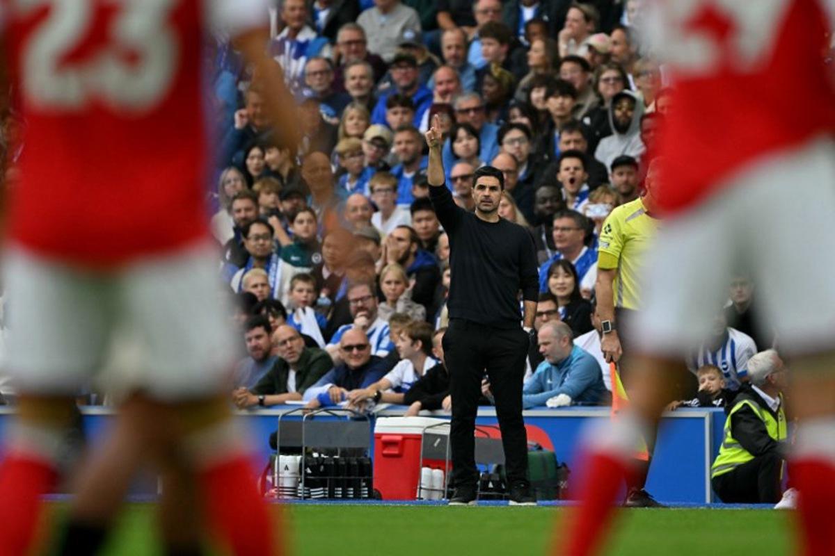 Arsenal's Spanish manager Mikel Arteta watches the players from the touchline during the English Premier League football match between Brighton and Hove Albion and Arsenal at the American Express Community Stadium in Brighton, southern England on September 19, 2026.  Glyn KIRK / AFP