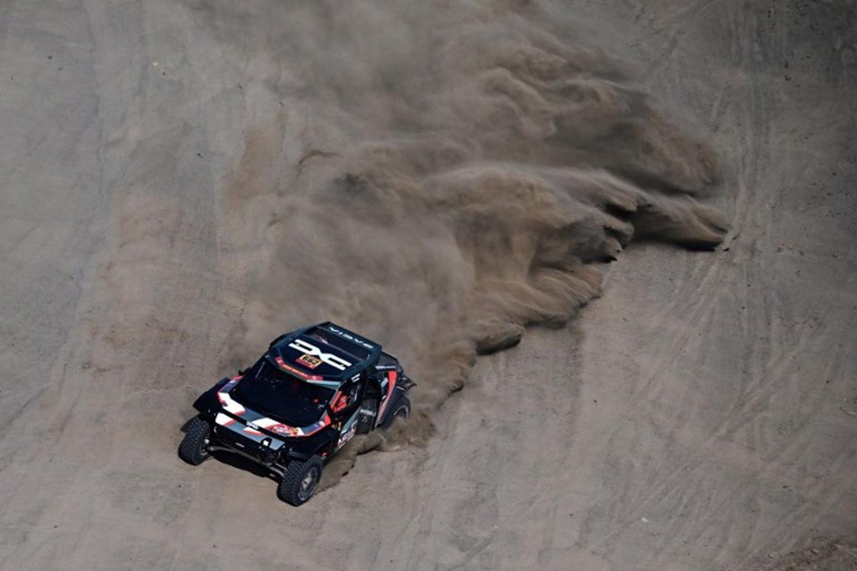 Dacia Sandriders' Qatari driver Nasser al-Attiyah and Belgian co-driver Fabian Lurquin compete in the Stage 1 of the 48th edition of the Dakar Rally 2026, between Yanbu and Yanbu, Saudi Arabia, on January 4, 2026.  Giuseppe CACACE / AFP