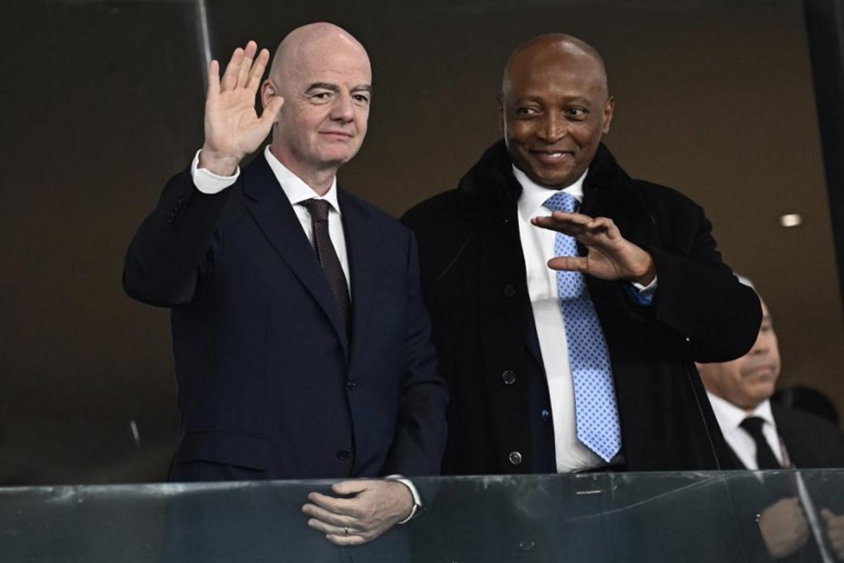 FIFA President Gianni Infantino (L) poses with CAF President Patrice Motsepe during the Africa Cup of Nations (CAN) round of 16 football match between South Africa and Cameroon at Al Medina Stadium in Rabat on January 4, 2026.   Paul ELLIS / AFP
