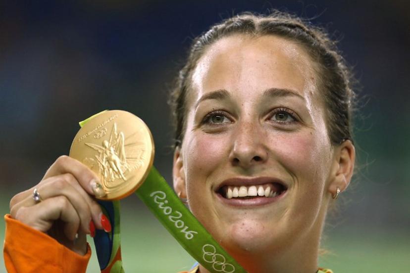 Gold medallist the Netherlands' Elis Ligtlee poses with her medal on the podium after the women's Keirin finals track cycling event at the Velodrome during the Rio 2016 Olympic Games in Rio de Janeiro on August 13, 2016.  Odd Andersen / AFP