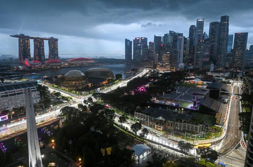 This photo shows the road circuit illuminated for the the upcoming Formula One Singapore Grand Prix at the Marina Bay Street Circuit in Singapore on October 1, 2025.  Roslan RAHMAN / AFP