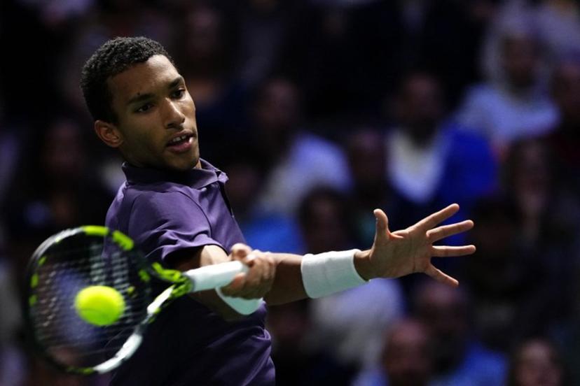 Canada's Felix Auger-Aliassime plays a forehand return to Monaco's Valentin Vacherot during their men's singles quarter-final match on day five of the Paris ATP Masters 1000 tennis tournament at the Paris La Défense Arena in Nanterre, on the outskirts of Paris, on October 31, 2025.  Dimitar DILKOFF / AFP