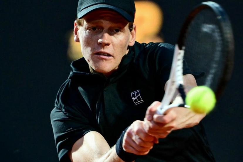 Italy's Jannik Sinner plays a backhand return to Argentina's Mariano Navone during their men's singles match of the ATP Rome Open tennis tournament at Foro Italico in Rome on May 10, 2025.  Marco BERTORELLO / AFP