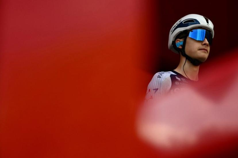Team Israel Premier Tech 's US rider Matthew Riccitello prepares to take the start of the third stage of the Vuelta a Espana, a 134 km race between San Maurizio Canavese and Ceres, in Italy's Piemonte region, on August 25, 2025.    Marco BERTORELLO / AFP