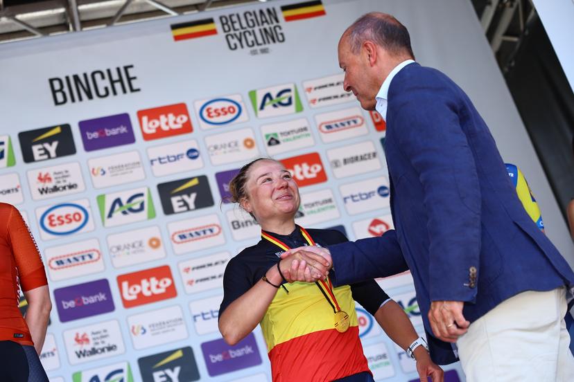 Belgian Justine Ghekiere celebrates on the podium in the national jersey after winning the women's elite road race of the Belgian Cycling Championships, 132,8 km from and to the Grand Place square in Binche on Sunday 29 June 2025. BELGA PHOTO DAVID PINTENS