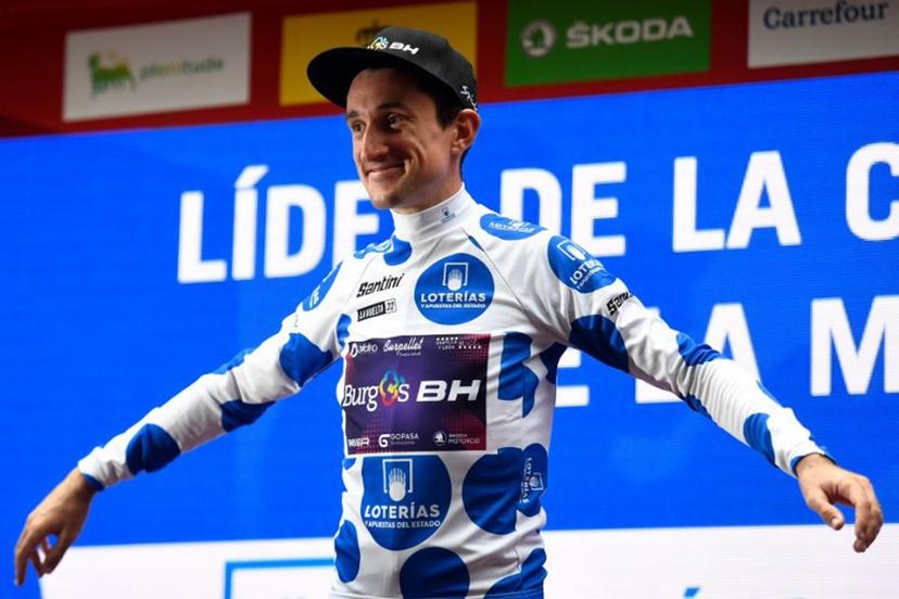 Team Burgos - BH's Monegasque rider Victor Langelotti celebrates on the podium wearing the best climber's jersey after the 5th stage of the 2022 La Vuelta cycling tour of Spain, a 187.2 km race from Irun to Bilbao, on August 24, 2022.  ANDER GILLENEA / AFP