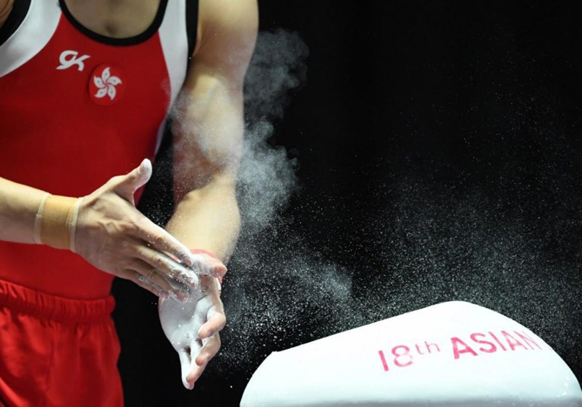 Hong Kong's Shek Wai Hung competes in the men's vault competition in the final of the artistic gymnastics event during the 2018 Asian Games in Jakarta on August 24, 2018.  PETER PARKS / AFP