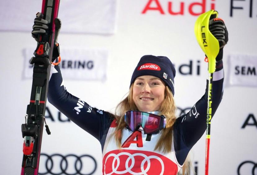Winner USA's Mikaela Shiffrin celebrates on the podium after the Women's Slalom race of the FIS Alpine Ski World Cup in Semmering, Austria on December 28, 2025.  GEORG HOCHMUTH / APA / AFP