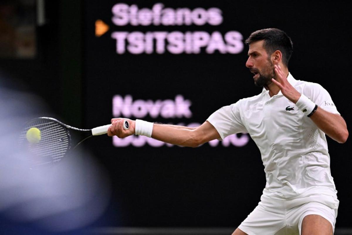 Serbia's Novak Djokovic returns the ball to Greece's Stefanos Tsitsipas during their men's singles second round tennis match on the third day of the 2026 Wimbledon Championships at The All England Lawn Tennis and Croquet Club in Wimbledon, southwest London, on July 1, 2026.  Kirill KUDRYAVTSEV / AFP